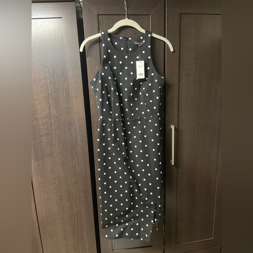 Sleeveless dress. Tags on. Never worn.